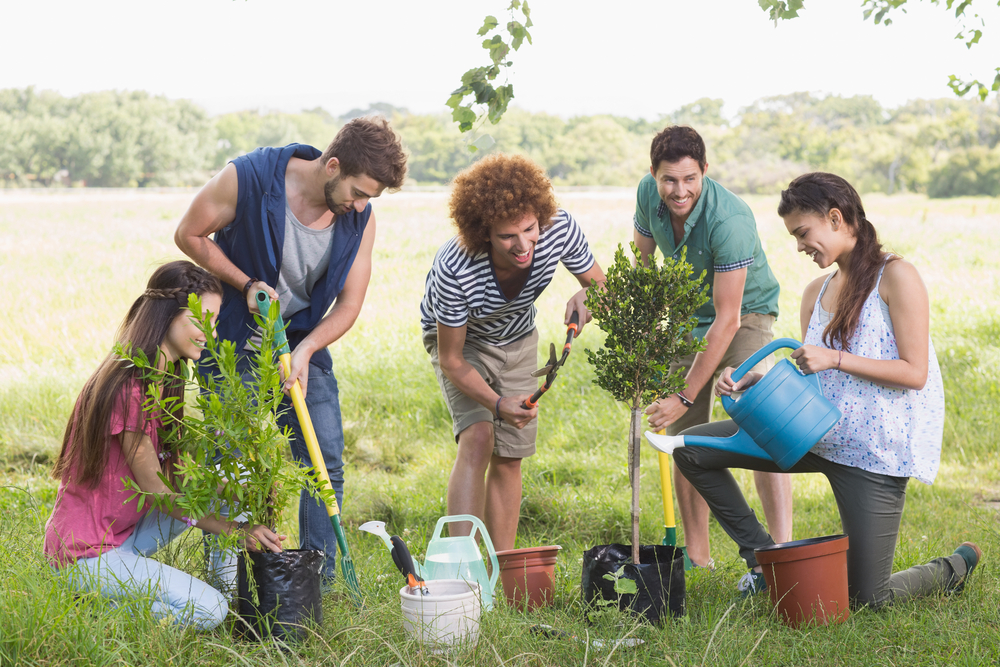 Happy friends gardening for the community on a sunny day-1